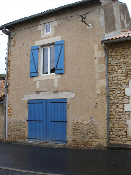 Rear view showing garage/basement doors